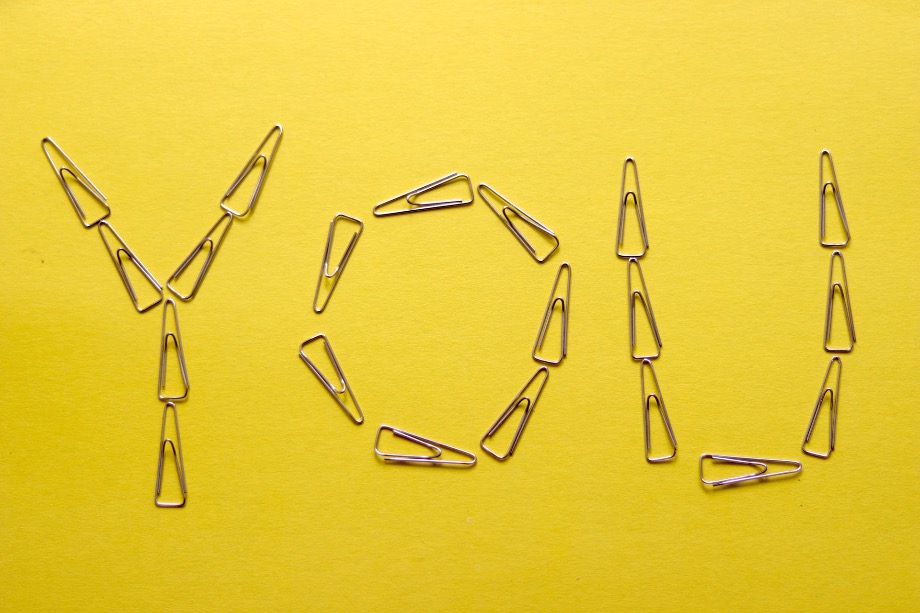 silver framed eyeglasses on yellow surface